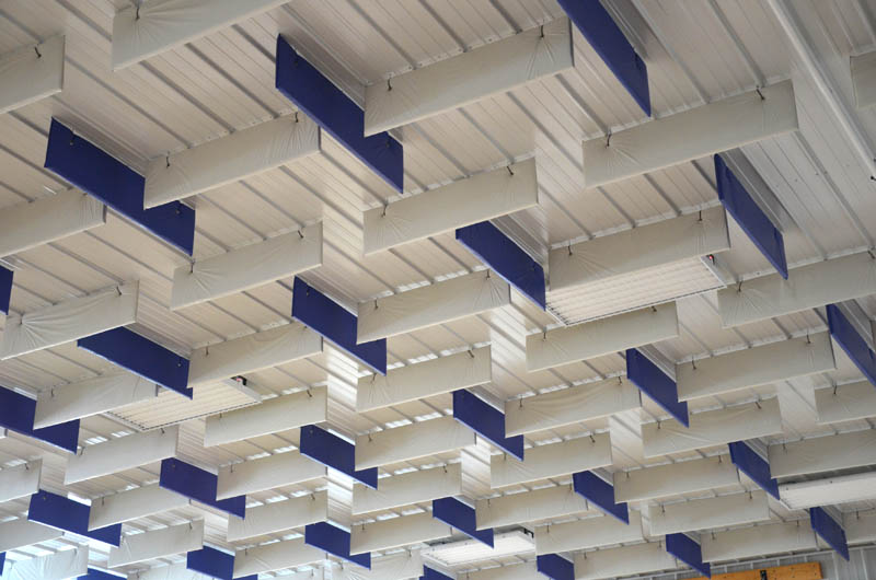 Blue and white VET baffles hanging from metal ceiling