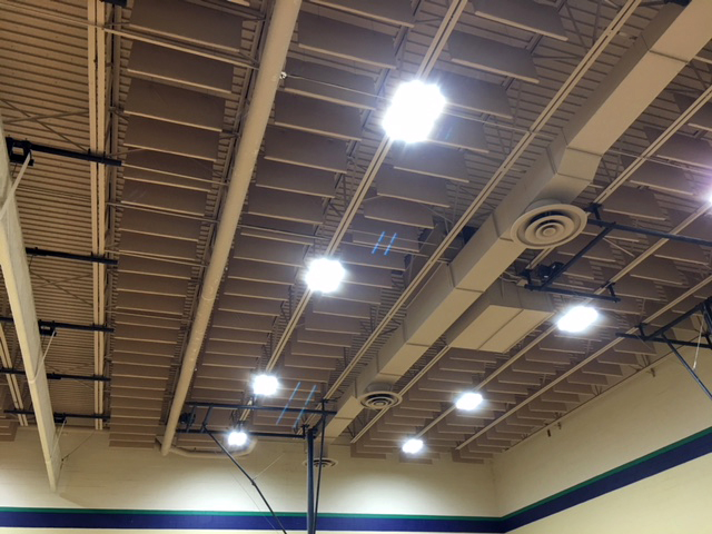 Acoustic VET Baffles hanging from ceiling between bar joists