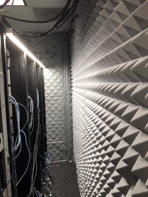 Melamine acoustic foam pyramid panels on walls of a server room