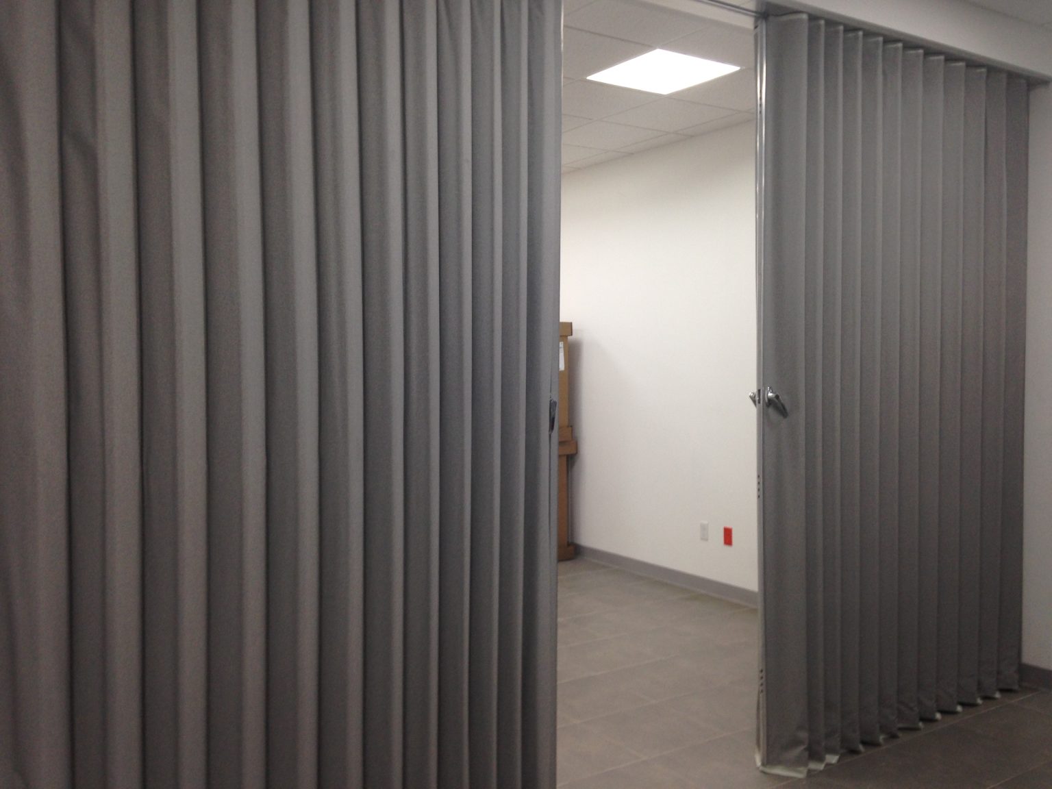 gray bi-parting acoustic room divider